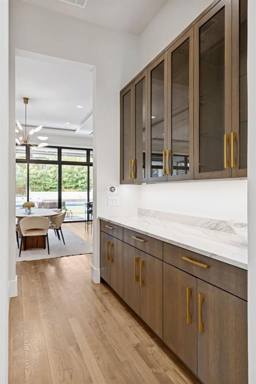 4447 Taos Road Dallas, TX 75209 - Photo 16 of 40 a living room with stainless steel appliances granite countertop a stove a sink and a large window