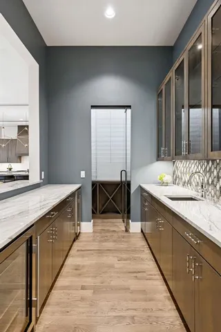 a spacious bathroom with a double vanity sink and a mirror