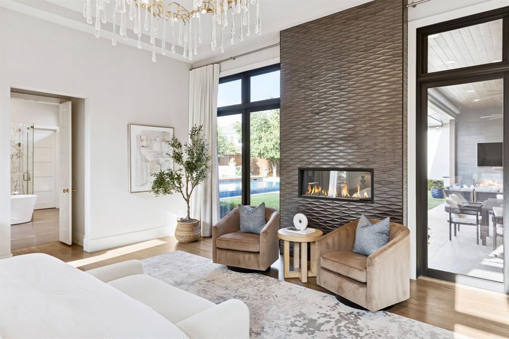 4447 Taos Road Dallas, TX 75209 - Photo 20 of 40 a living room with furniture and a fireplace