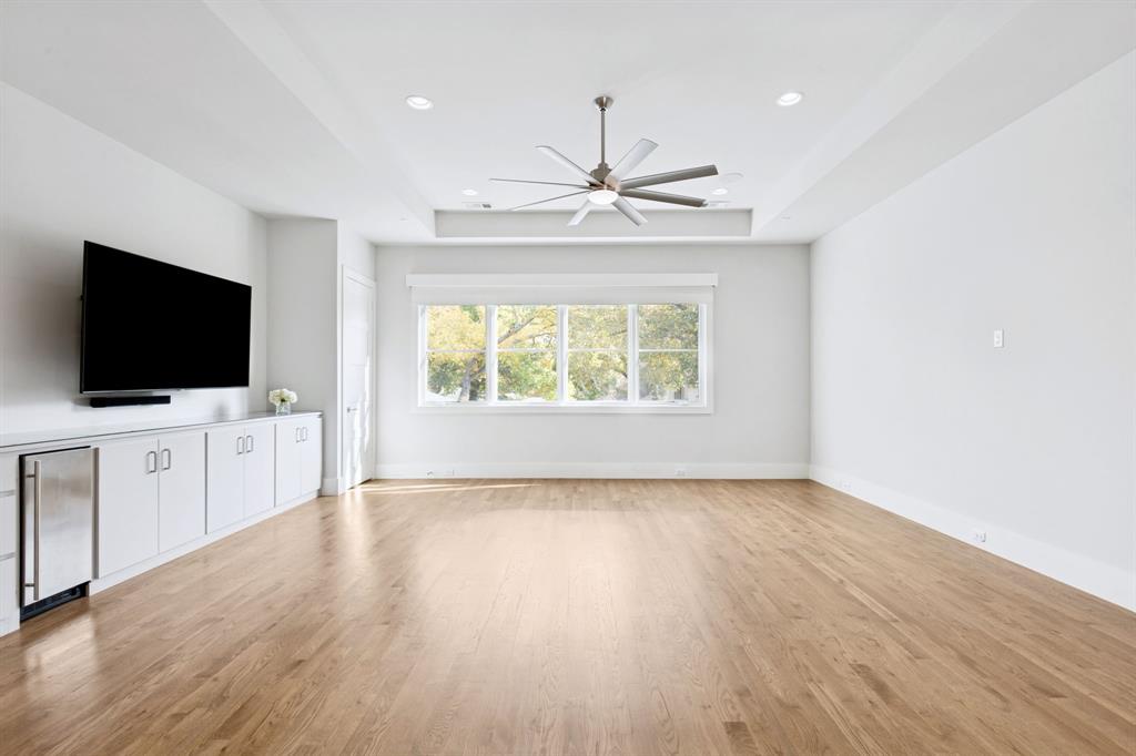 4447 Taos Road Dallas, TX 75209 - Photo 26 of 40 en empty room with wooden floor and window