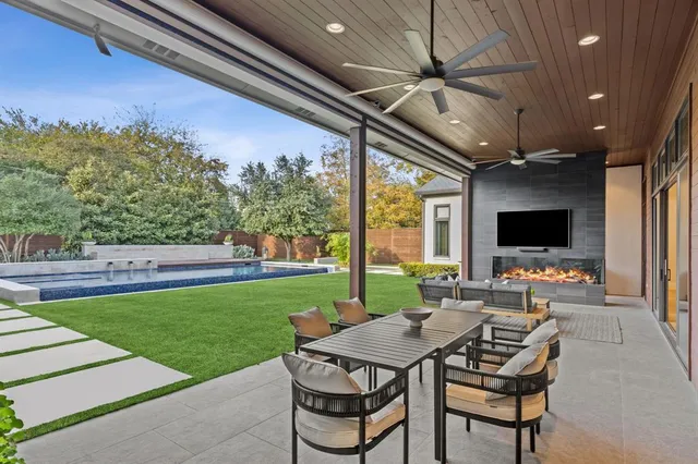 a view of a patio with a table and chairs