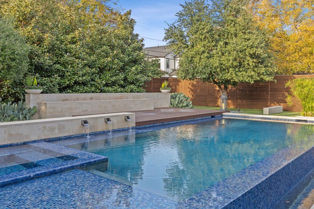 4447 Taos Road Dallas, TX 75209 - Photo 32 of 40 a view of a swimming pool with a yard