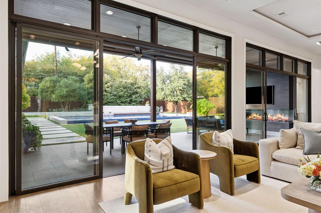 4447 Taos Road Dallas, TX 75209 - Photo 10 of 40 a living room with furniture and a floor to ceiling window