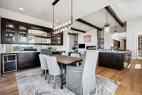 a living room with stainless steel appliances kitchen island granite countertop furniture and a kitchen view