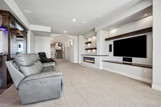 a kitchen with stainless steel appliances granite countertop a sink and a stove