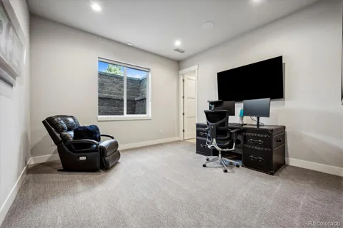 a bed room with furniture and a large window