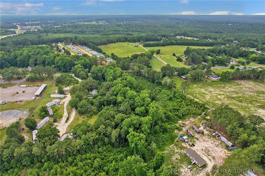 0 Mockingbird Hill Road Raeford, NC 28376 - Photo 12 of 14 an aerial view of lake residential house with outdoor space and trees