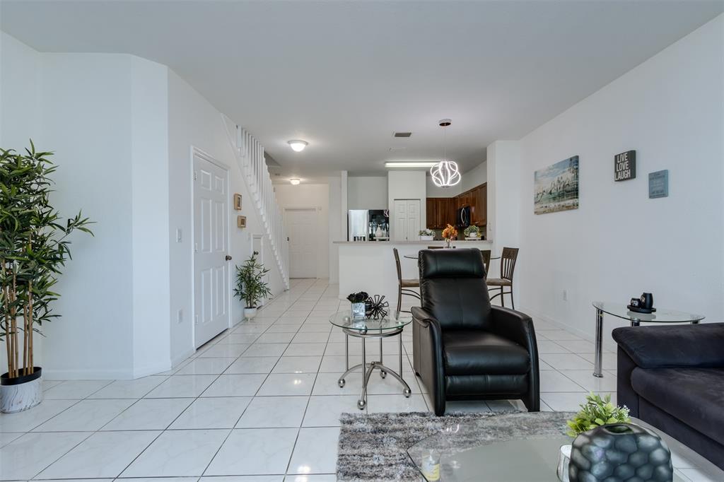 5545 Monte Carlo Place, Unit 5545 Margate, FL 33068 - Photo 11 of 41 a living room with furniture and a potted plant