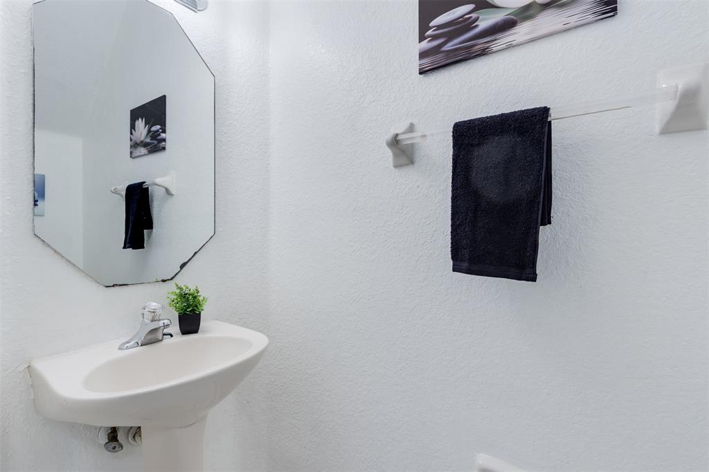5545 Monte Carlo Place, Unit 5545 Margate, FL 33068 - Photo 12 of 41 a bathroom with a sink and a mirror