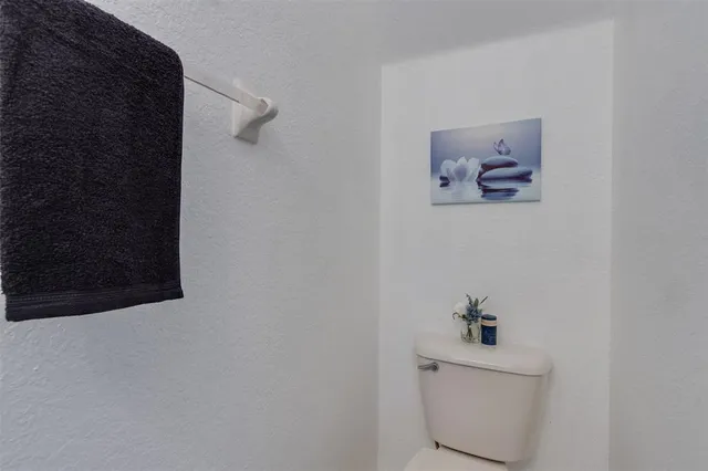 a bathroom with a toilet and a sink