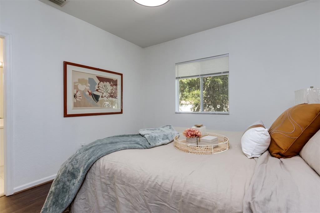 5545 Monte Carlo Place, Unit 5545 Margate, FL 33068 - Photo 16 of 41 a bedroom with a bed and a chair