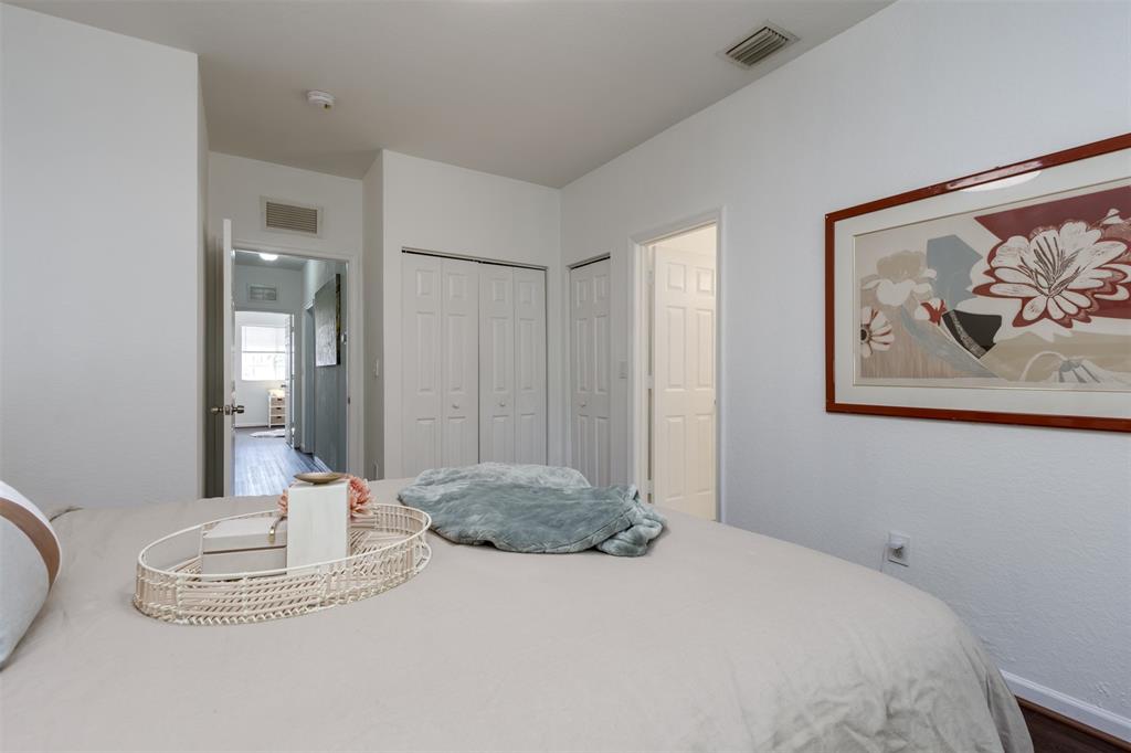 5545 Monte Carlo Place, Unit 5545 Margate, FL 33068 - Photo 17 of 41 a bedroom with a bed and a painting on the wall