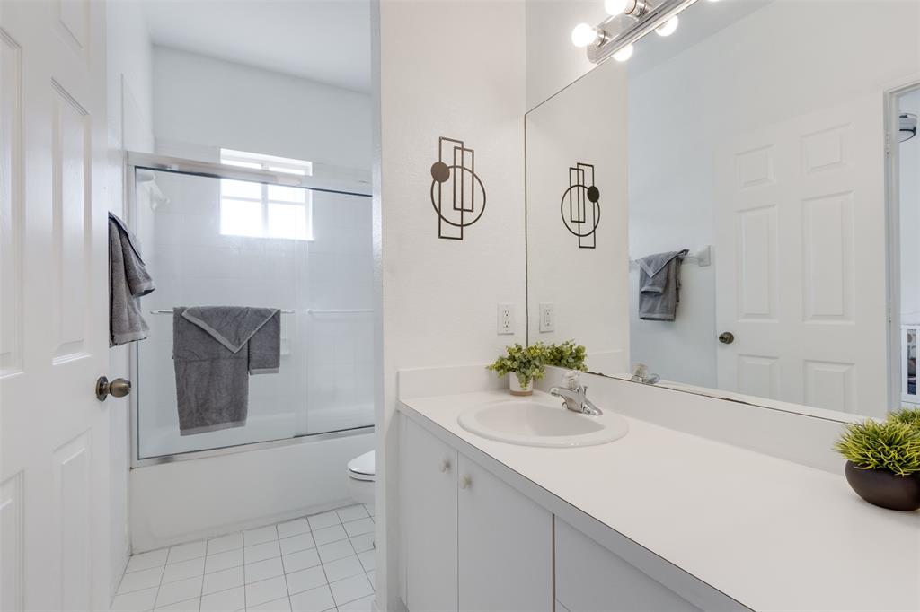 5545 Monte Carlo Place, Unit 5545 Margate, FL 33068 - Photo 24 of 41 a bathroom with a sink vanity and a mirror