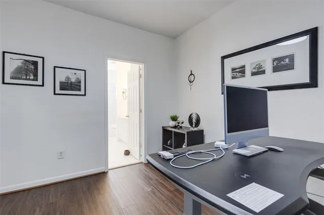 a view of a workspace with furniture