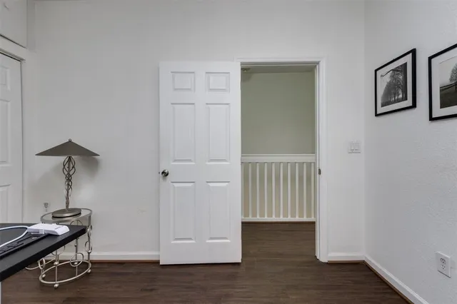 a view of room with wooden floor