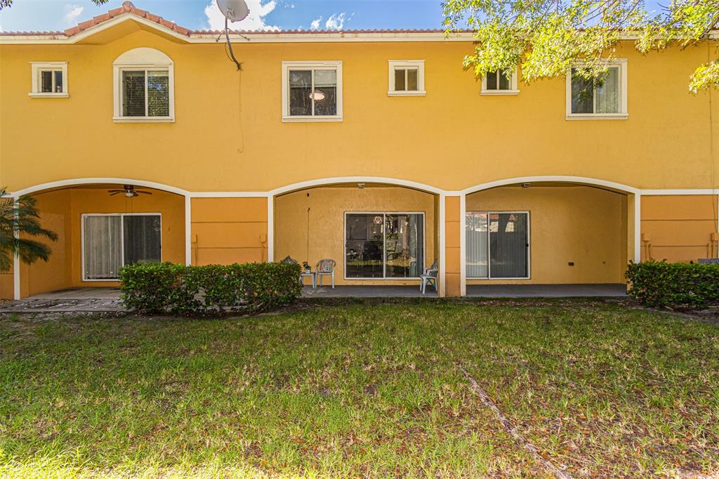 5545 Monte Carlo Place, Unit 5545 Margate, FL 33068 - Photo 33 of 41 a front view of a house with garden