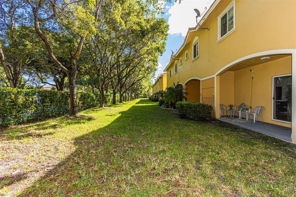 5545 Monte Carlo Place, Unit 5545 Margate, FL 33068 - Photo 35 of 41 a view of a fountain in front of a house