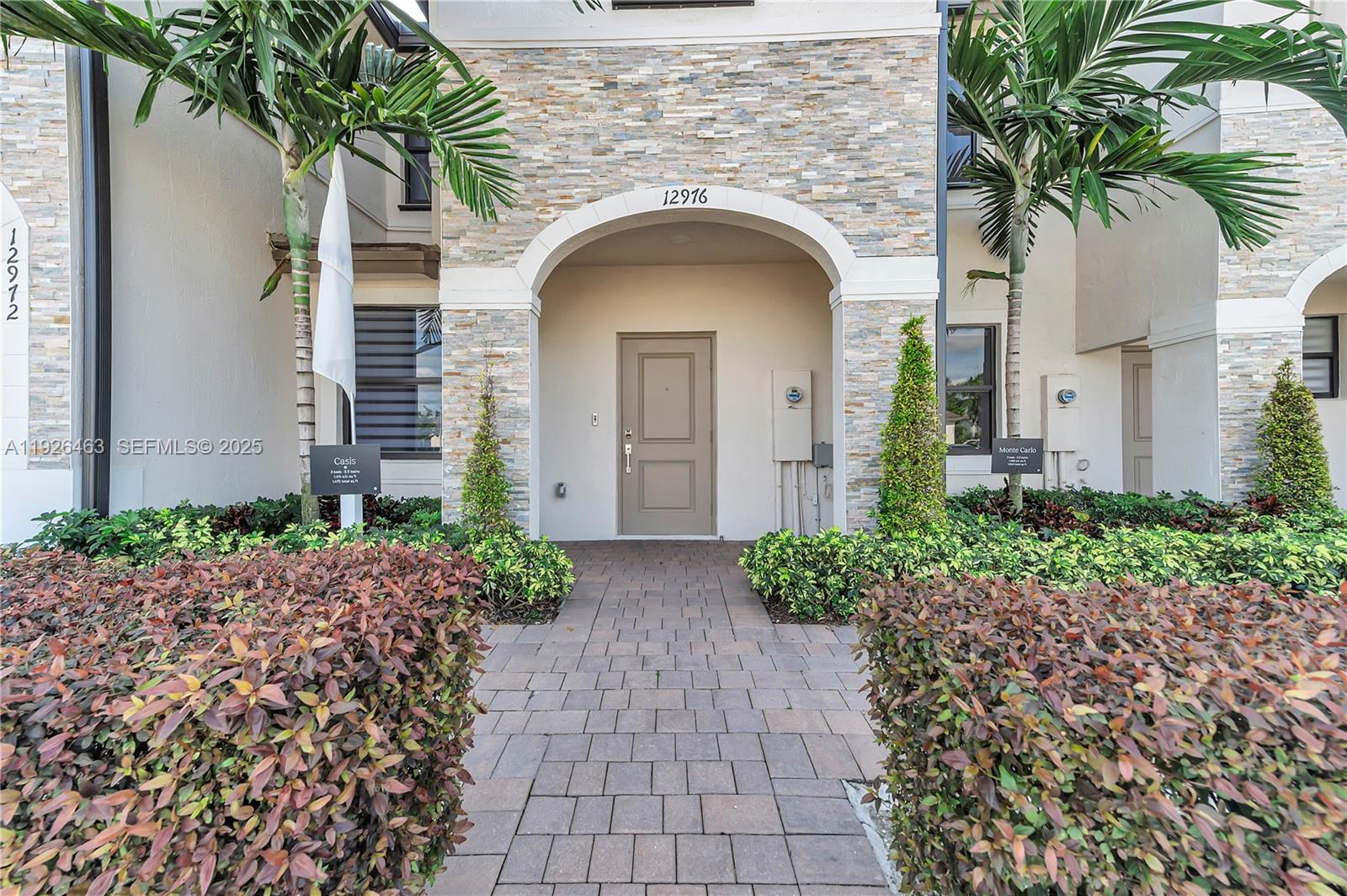 a front view of a house with garden