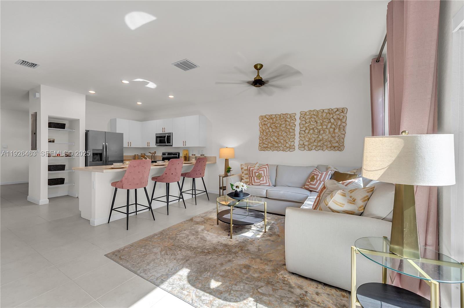 12976 Southwest 233rd Terrace Homestead, FL 33032 - Photo 11 of 27 a living room with furniture and a lamp