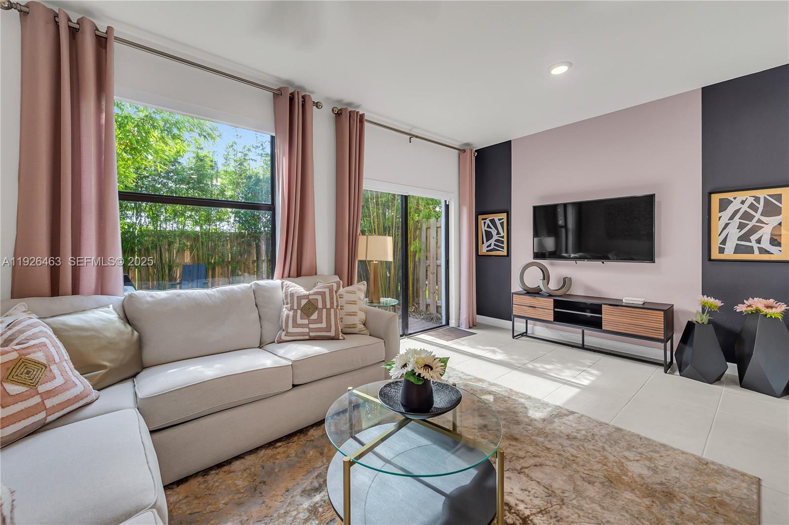 12976 Southwest 233rd Terrace Homestead, FL 33032 - Photo 12 of 27 a living room with furniture and a flat screen tv