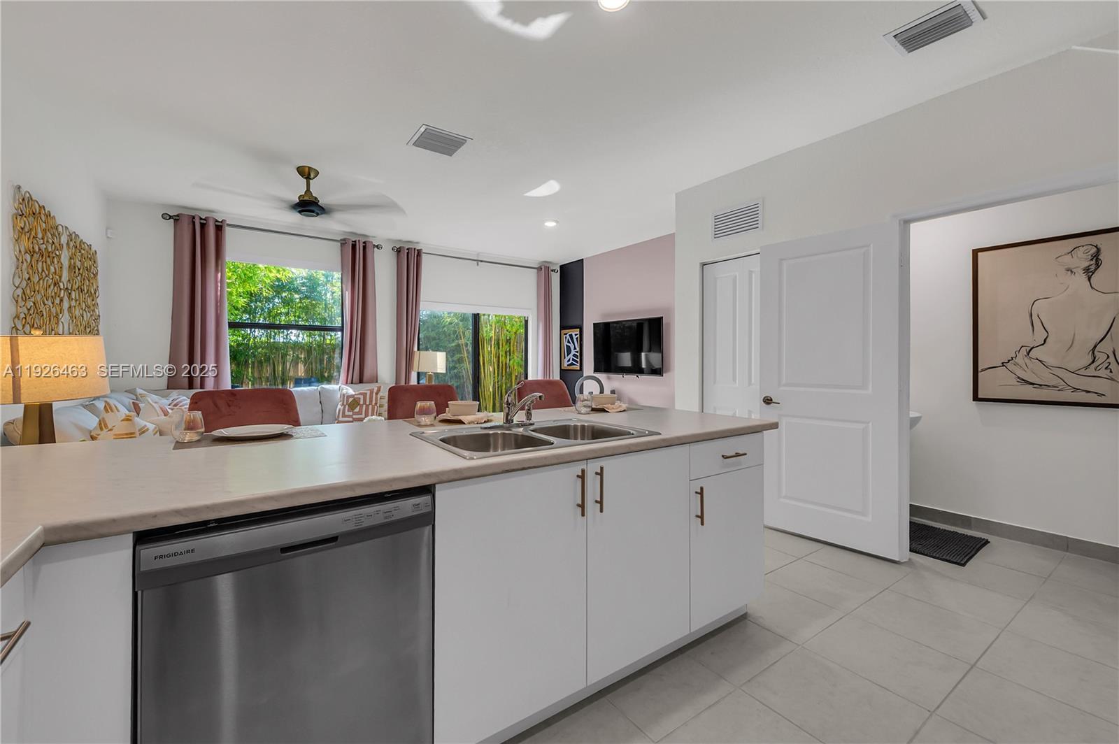 12976 Southwest 233rd Terrace Homestead, FL 33032 - Photo 15 of 27 a kitchen with sink cabinets and window