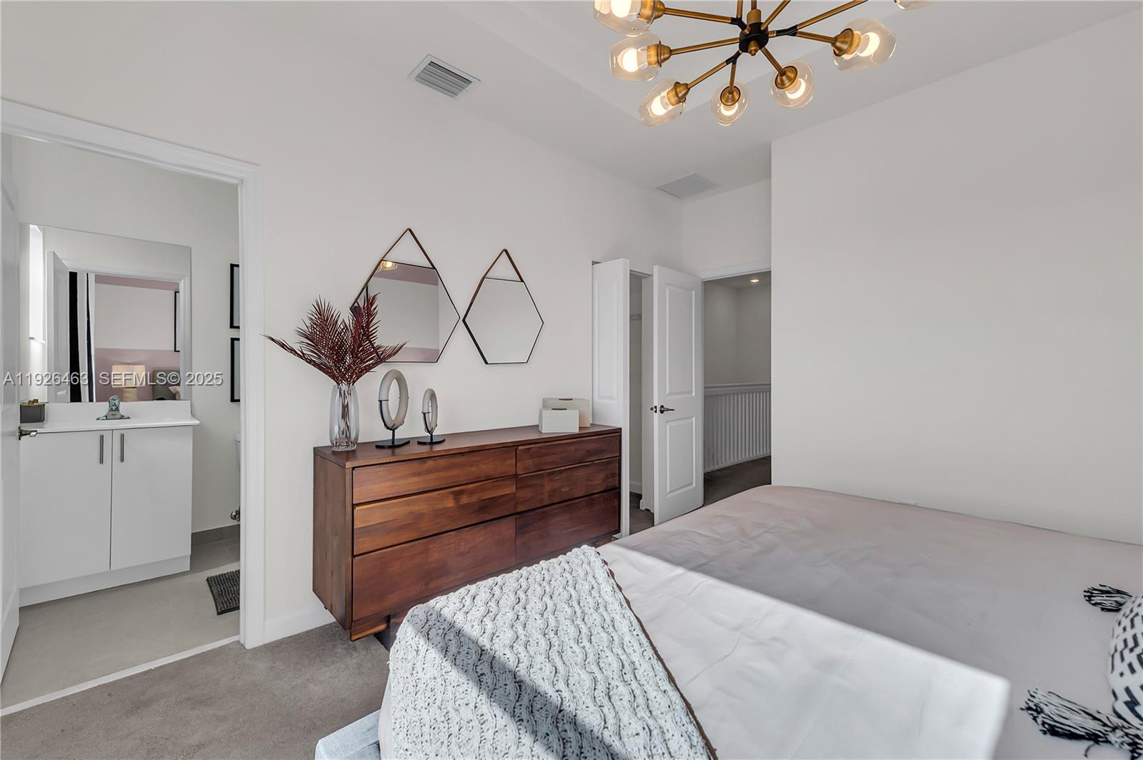 12976 Southwest 233rd Terrace Homestead, FL 33032 - Photo 20 of 27 a bedroom with a bed and ceiling fan