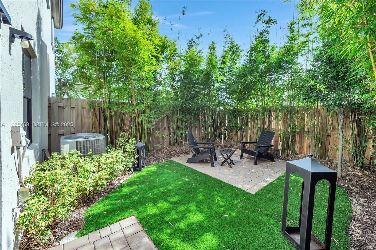 12976 Southwest 233rd Terrace Homestead, FL 33032 - Photo 26 of 27 a view of a chair and table in backyard of the house