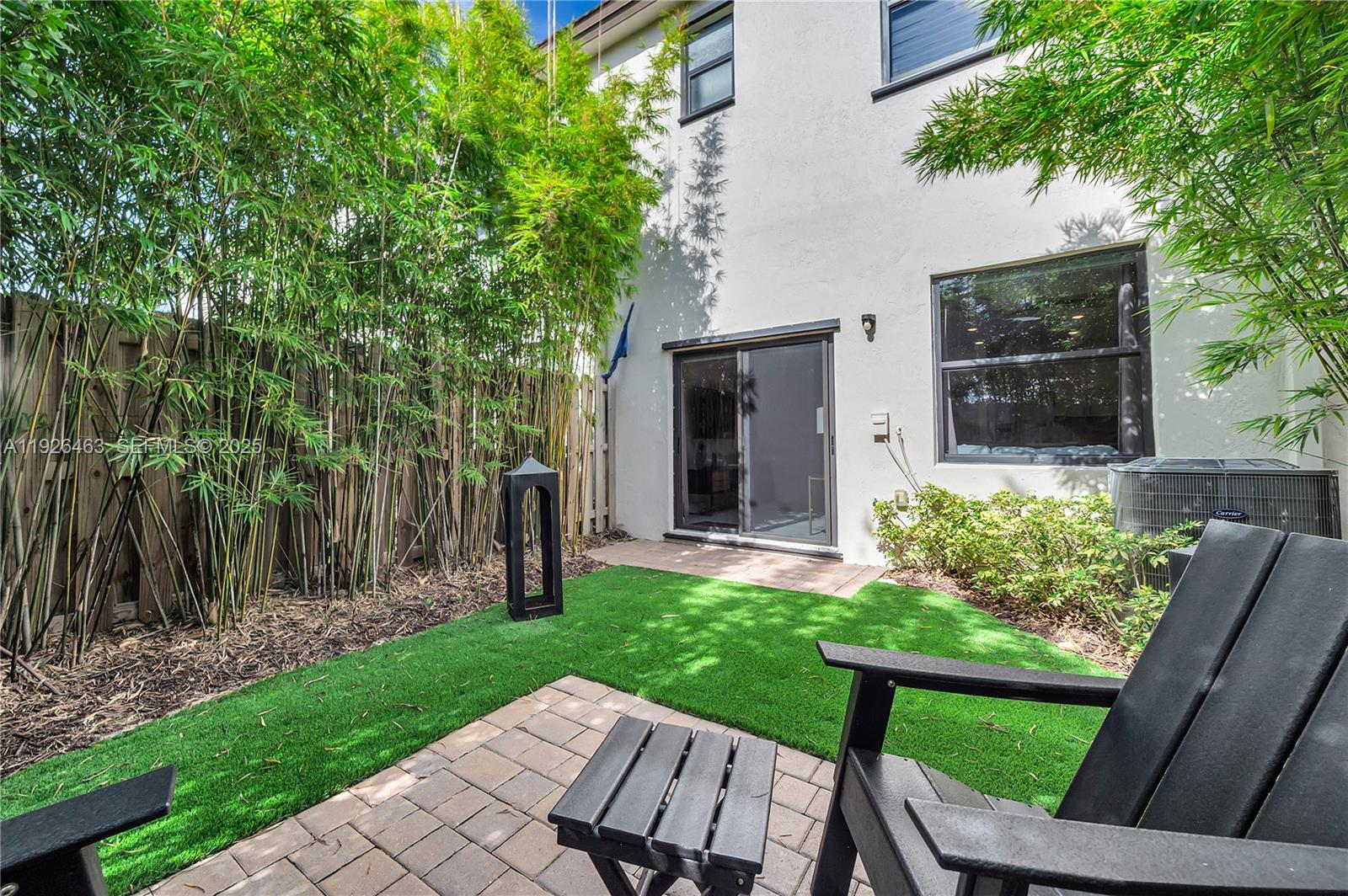 12976 Southwest 233rd Terrace Homestead, FL 33032 - Photo 27 of 27 a view of a chair and table in backyard of the house