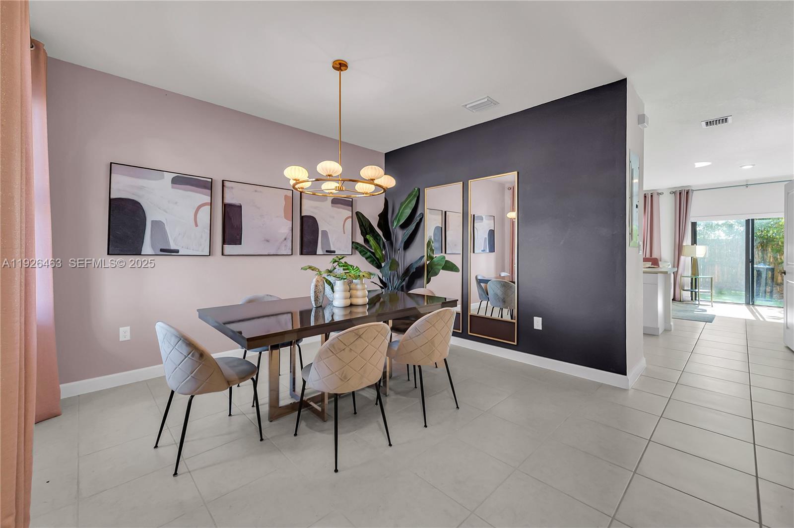 12976 Southwest 233rd Terrace Homestead, FL 33032 - Photo 4 of 27 a view of a dining room with furniture and chandelier