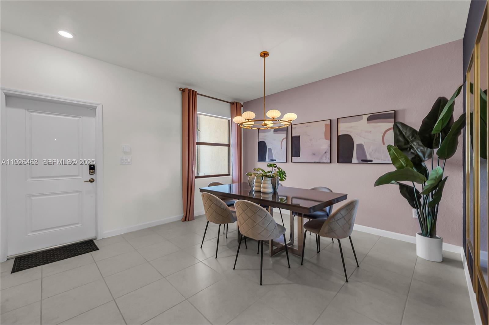 12976 Southwest 233rd Terrace Homestead, FL 33032 - Photo 5 of 27 a view of a dining room with furniture and chandelier
