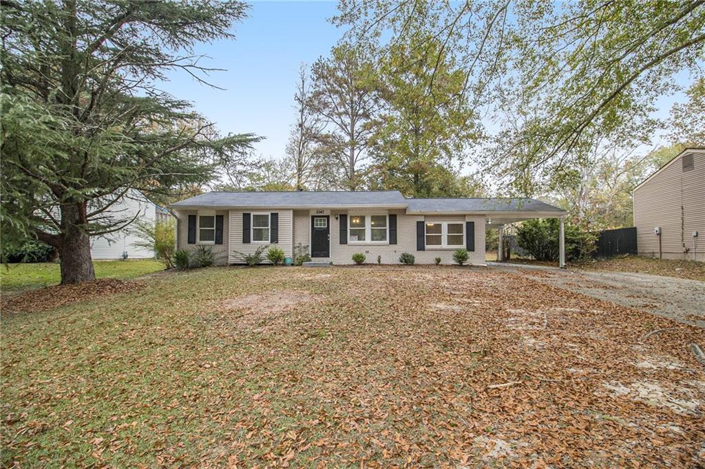 6940 Kimberly Mill Road Atlanta, GA 30349 - Photo 1 of 1 front view of a house with a yard