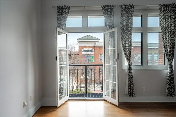 a living room with furniture a rug and a chandelier