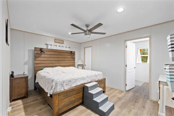 a bed room with a bed and a chandelier