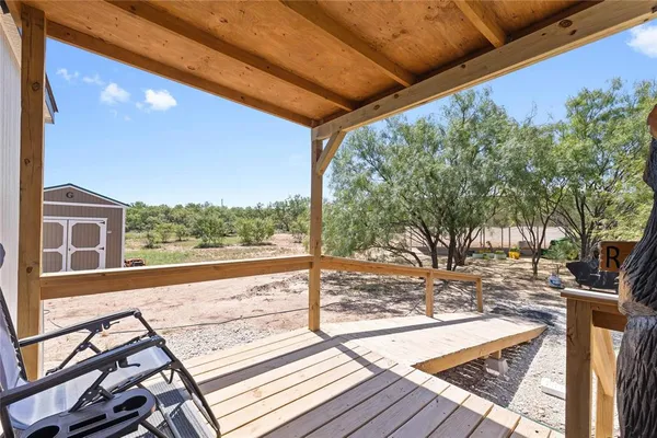 a view of a backyard of the house