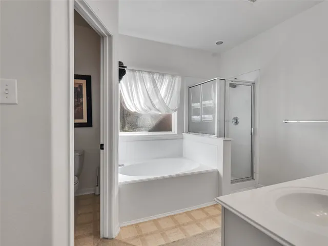 a bathroom with a bathtub and a sink