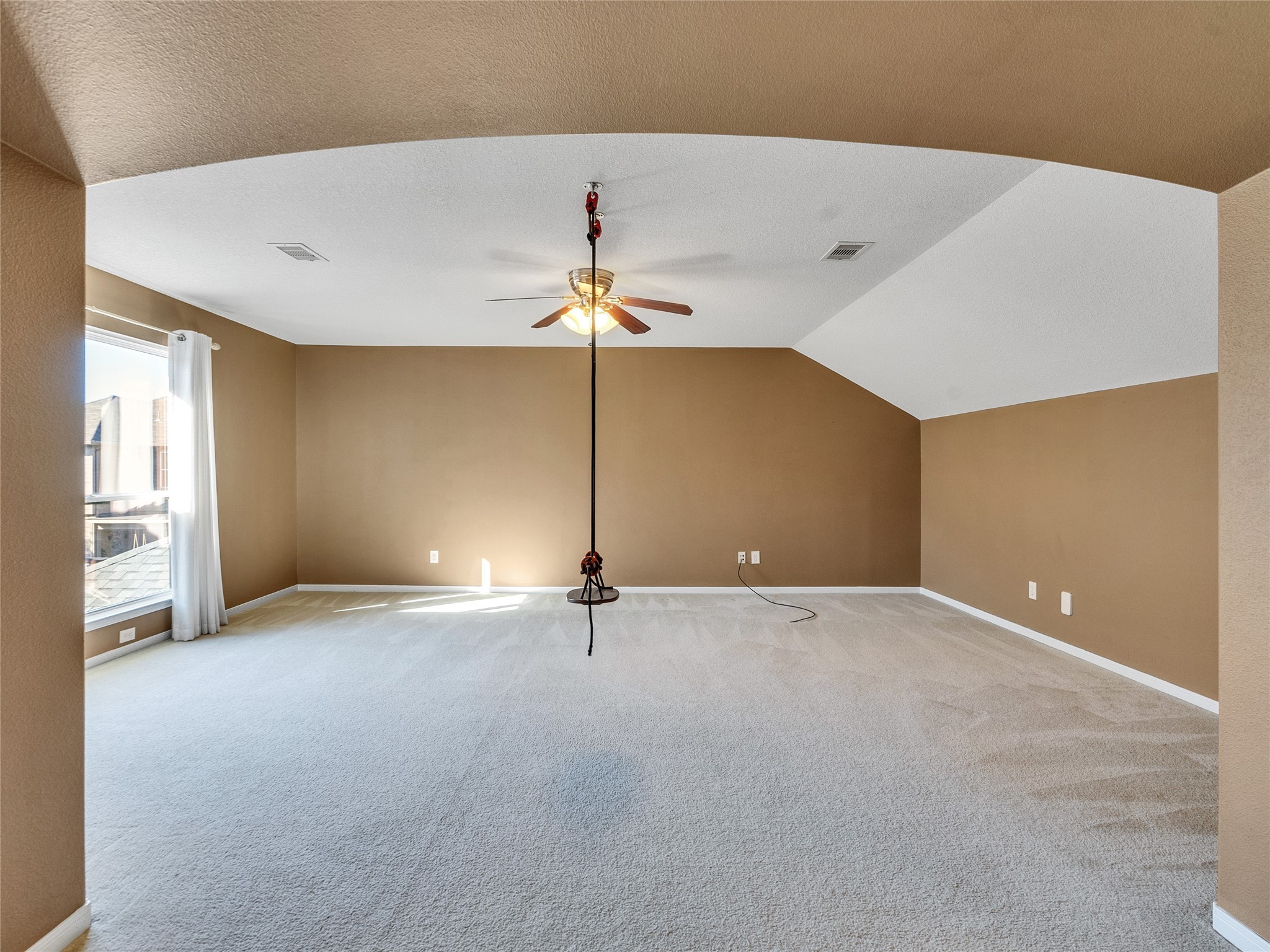9915 Valance Way Conroe, TX 77385 - Photo 21 of 31 an empty room with windows and fan