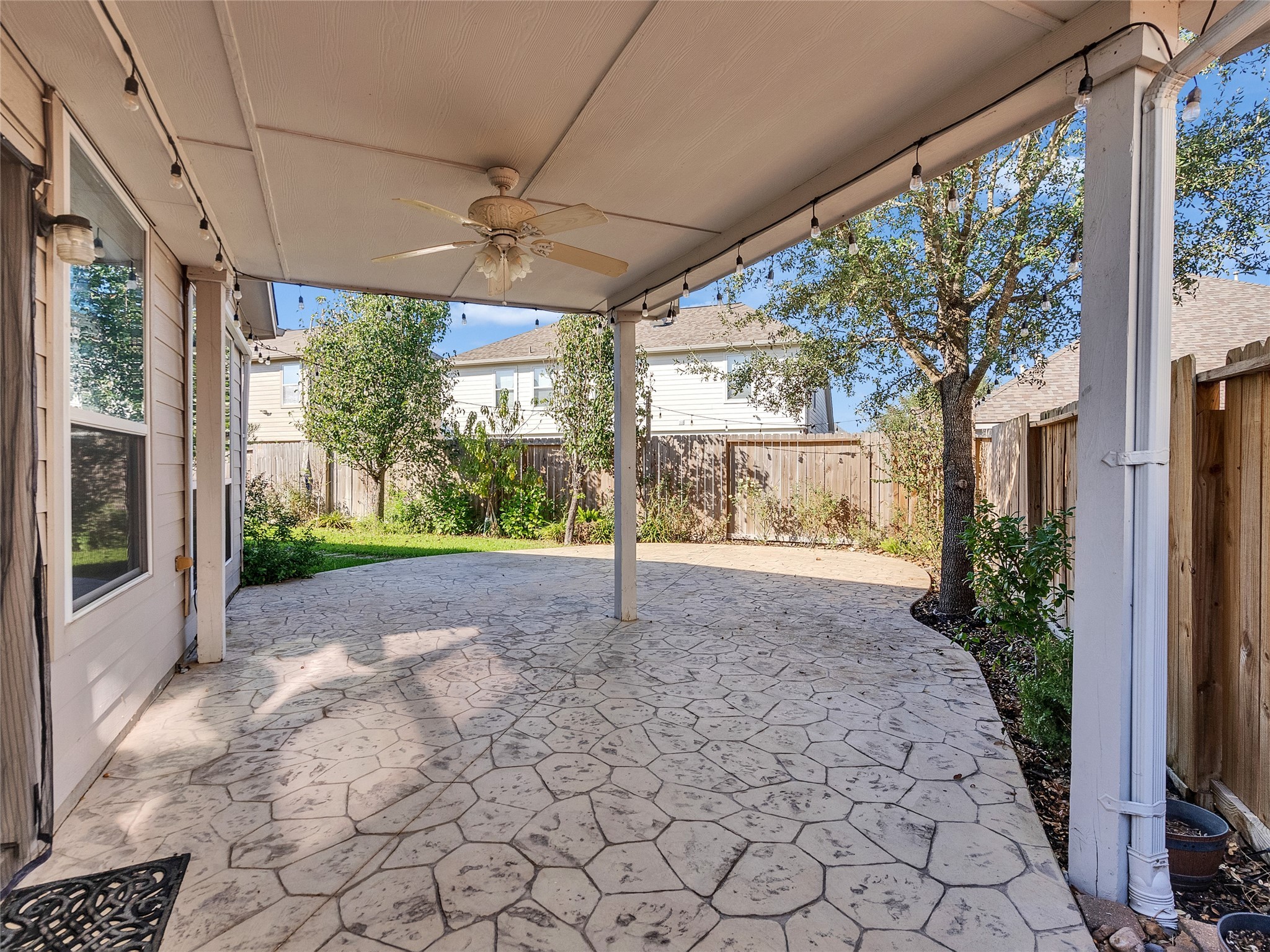 9915 Valance Way Conroe, TX 77385 - Photo 29 of 31 a view of a porch with plants and a backyard