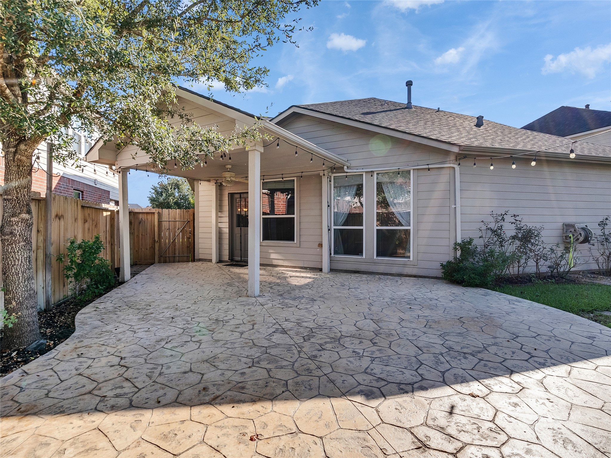 9915 Valance Way Conroe, TX 77385 - Photo 30 of 31 a view of a house with a yard and potted plants