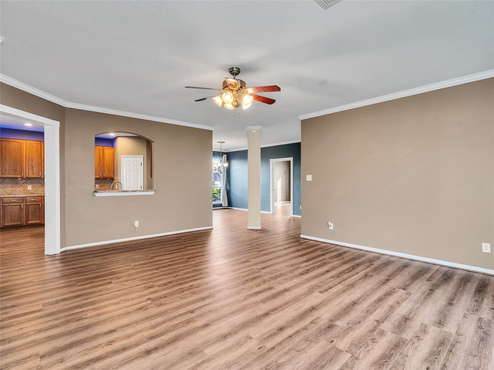 9915 Valance Way Conroe, TX 77385 - Photo 6 of 31 a view of an empty room with window and wooden floor