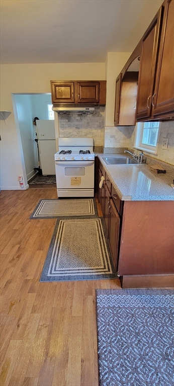 64 Clark Street, Unit 1 Malden, MA 02148 - Photo 2 of 8 a kitchen with a sink and cabinets