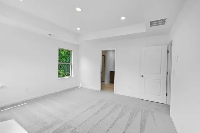 a bathroom with a double vanity sink mirror and shower