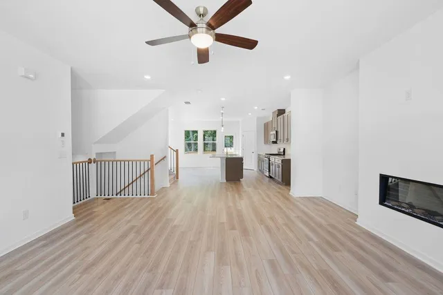 a view of a hallway with stairs