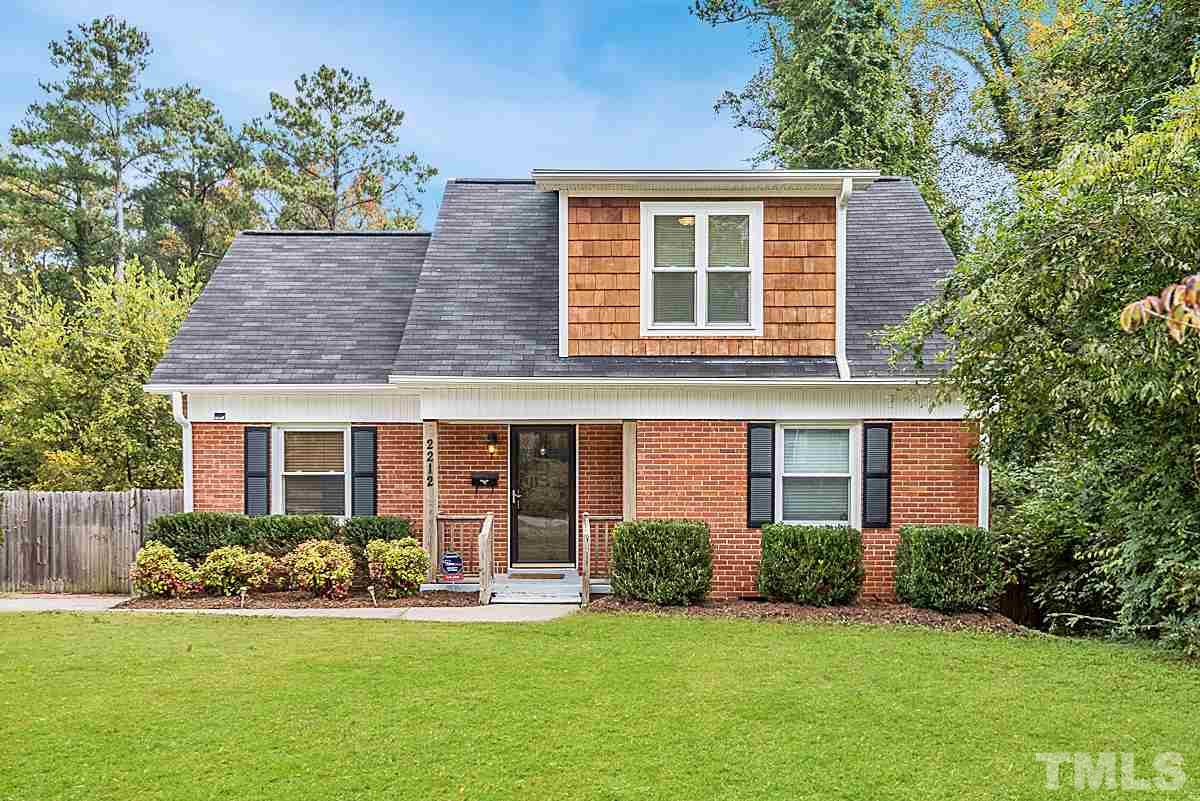 2212 Rumson Road Raleigh, NC 27610 - Photo 1 of 19 a front view of a house with a yard