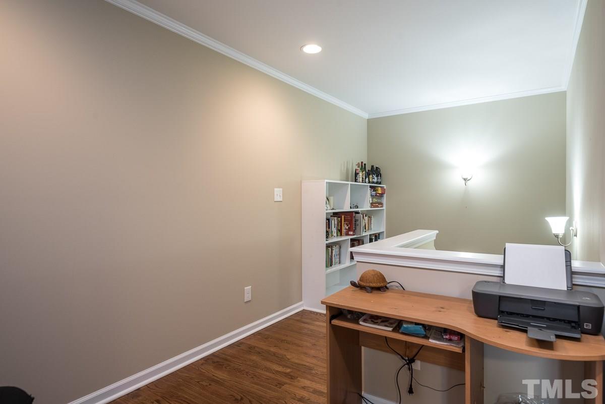 2212 Rumson Road Raleigh, NC 27610 - Photo 14 of 19 a room with furniture and a wooden floor