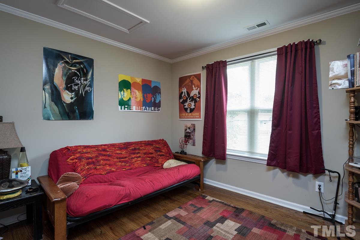2212 Rumson Road Raleigh, NC 27610 - Photo 15 of 19 a bedroom with a bed and a window