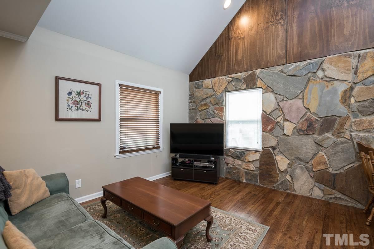 2212 Rumson Road Raleigh, NC 27610 - Photo 3 of 19 a living room with furniture and a flat screen tv