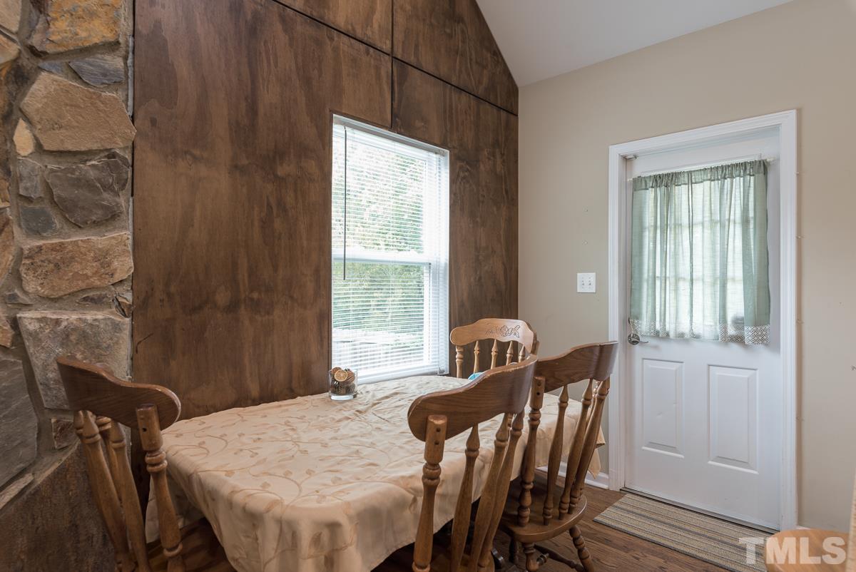 2212 Rumson Road Raleigh, NC 27610 - Photo 6 of 19 a view of a dining room with furniture and window