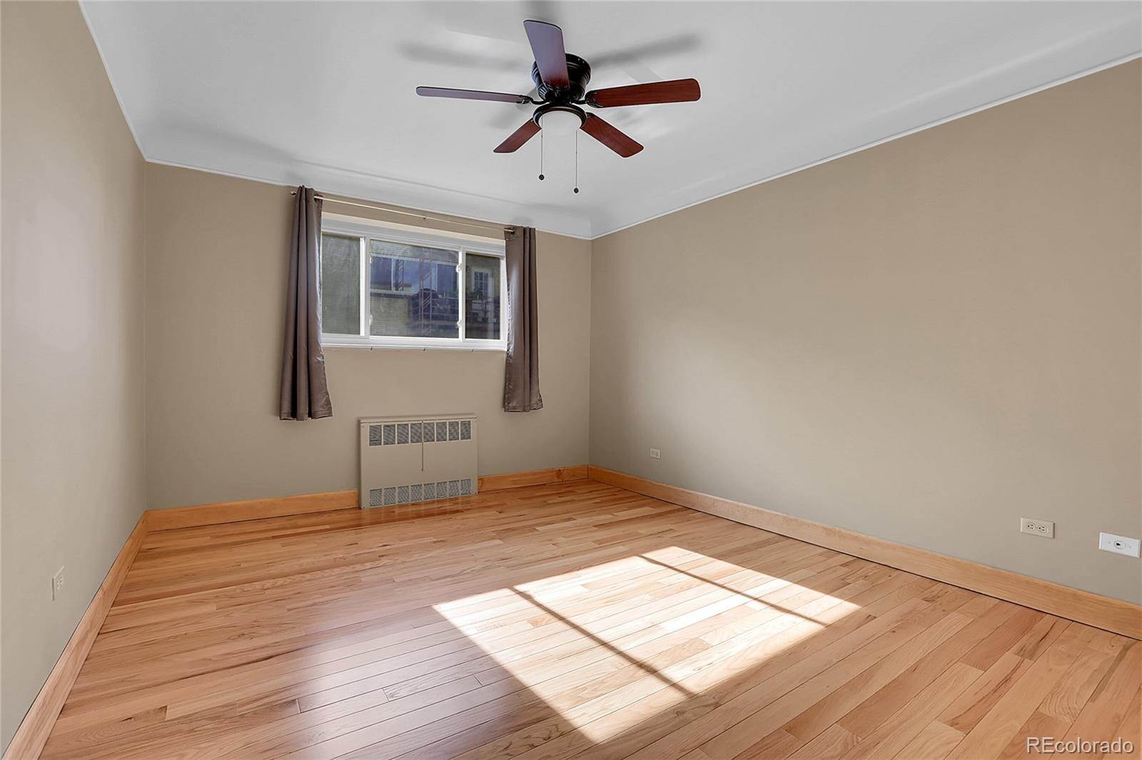 1175 Emerson Street, Unit 202 Denver, CO 80218 - Photo 18 of 31 a view of an empty room and window