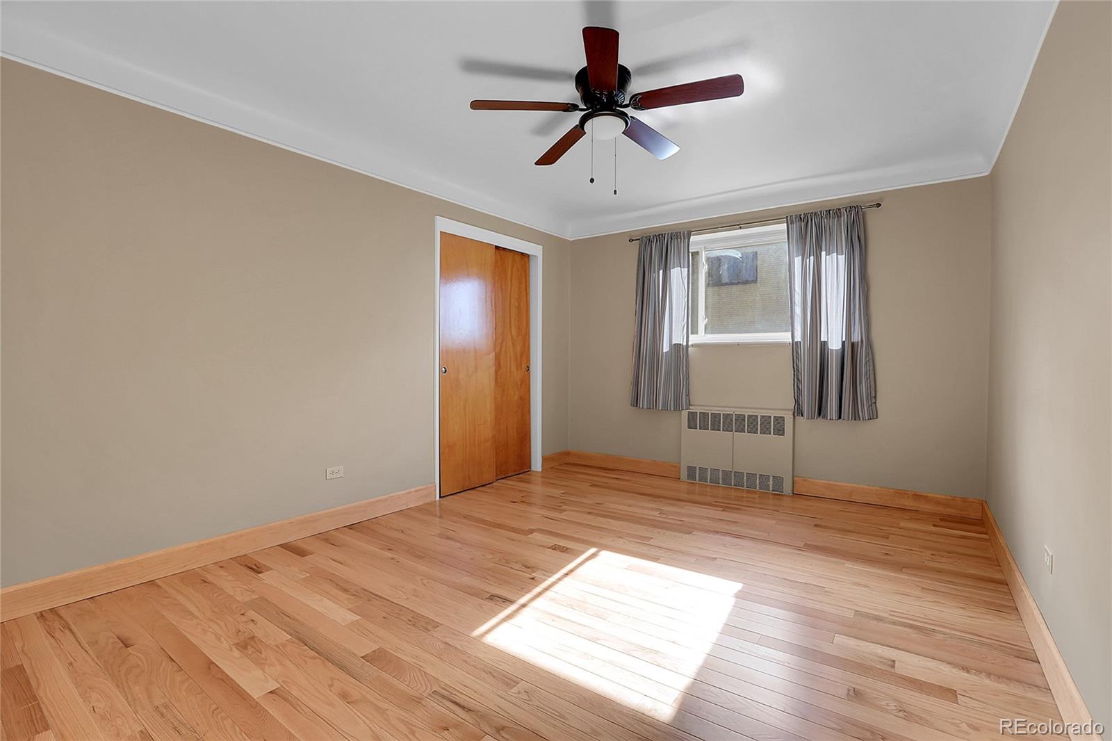 1175 Emerson Street, Unit 202 Denver, CO 80218 - Photo 21 of 31 a view of empty room with wooden floor