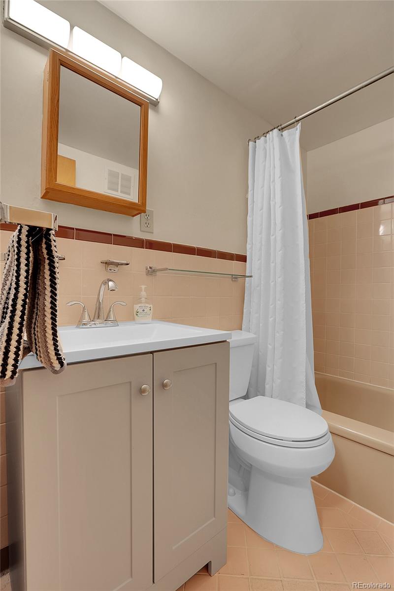 1175 Emerson Street, Unit 202 Denver, CO 80218 - Photo 25 of 31 a bathroom with a sink and a toilet